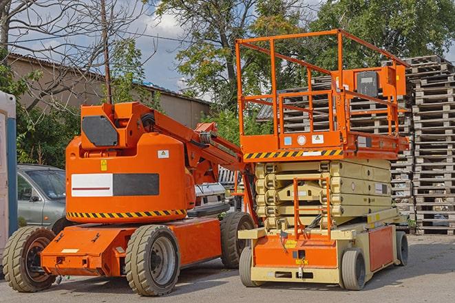 forklift moving heavy loads in busy warehouse setting in French Camp CA