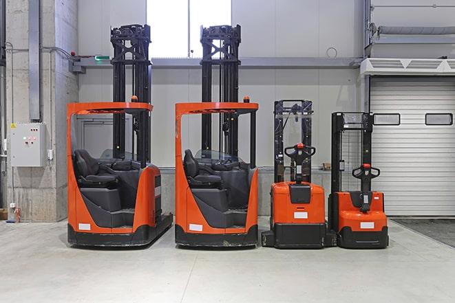 forklifts arranging cargo in a distribution center